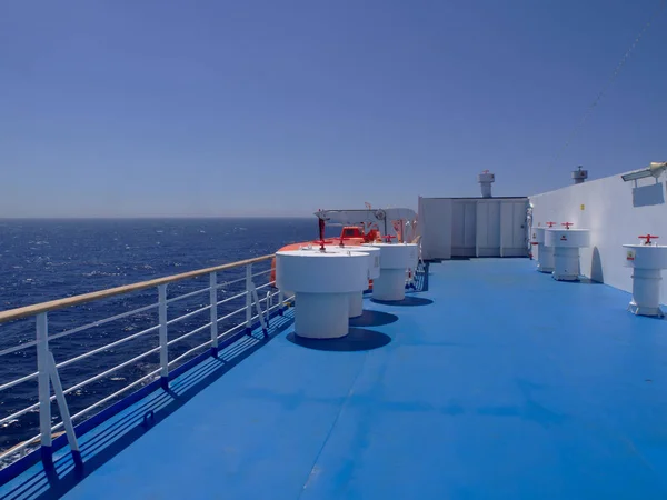 Ship ferry blue colored deck with  no people while sailing at Ae