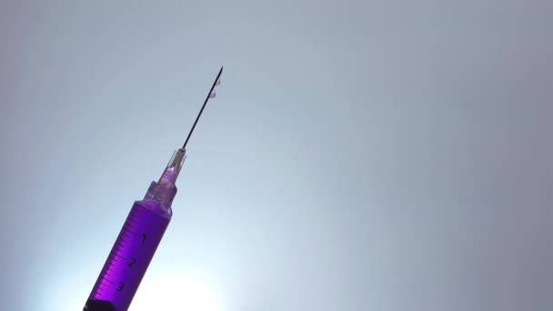 Slanted Syringe Dripping Purple Liquid — Stock Video