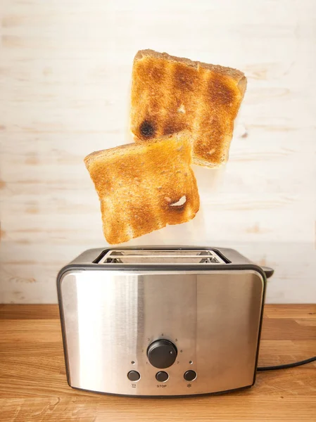 Jumping toasts. Preparing breakfast in modern toaster — Stock Photo, Image