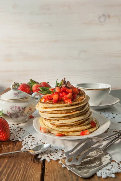 Strawberry chocolate pancakes on a vintage table — Stock Photo, Image