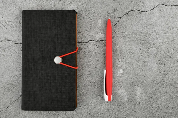 Cuaderno negro y pluma roja. Cuaderno en blanco y bolígrafo rojo. Cuaderno en blanco y pluma roja sobre fondo de hormigón gris. vista desde arriba . — Foto de Stock