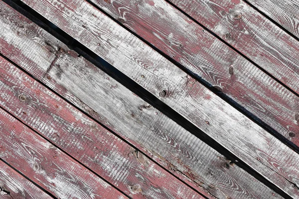 Latar belakang kayu merah-abu-abu. Papan horizontal. Kulit cat tua. Papan tua. Tekstur kayu abu-abu merah dari papan cat usang. Tekstur kayu abu-abu merah dari papan yang sudah usang — Stok Foto