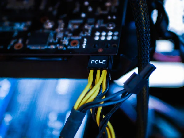 Connecting a video card through PCI-E. Mining through a video card. blue effect. illegal gallop. — Stock Photo, Image