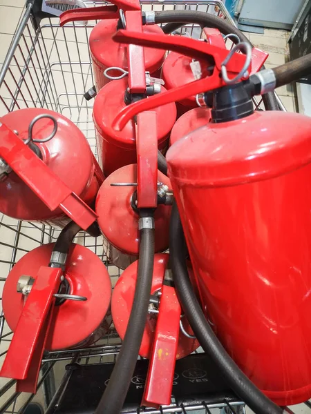 Red tank of fire extinguisher. Overview of a powerful industrial fire extinguishing system. Emergency equipment for industrial refinery crude oil and gas.compressed gas carbon dioxide in side.