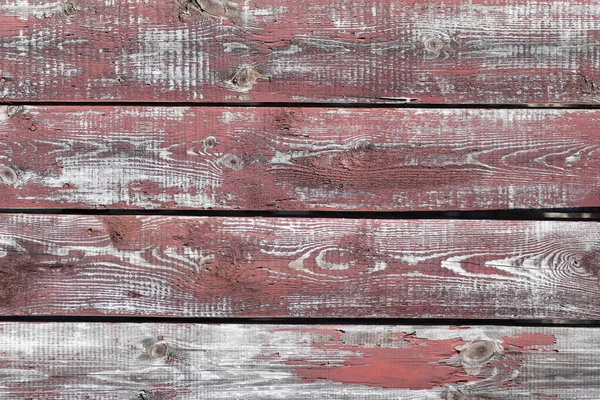 Red-gray wooden background. horizontal boards. old paint peels off. old boards. Red gray wood texture of a worn painted board. Red gray wood texture of old worn painted board — Stock Photo, Image