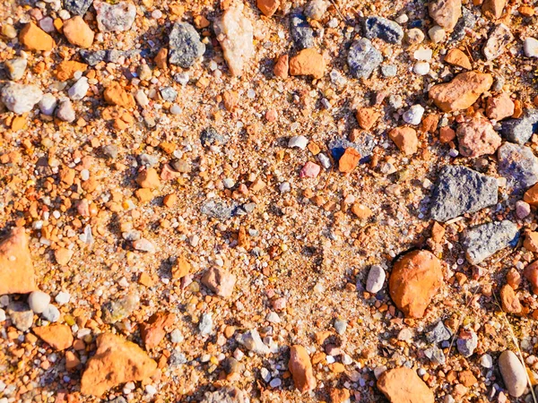 Orange little stones. in the sun close up. Texture for the background. — Stock Photo, Image