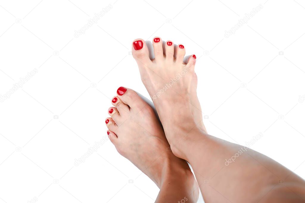 Female legs with painted nails in red. on an isolated background. High quality photo