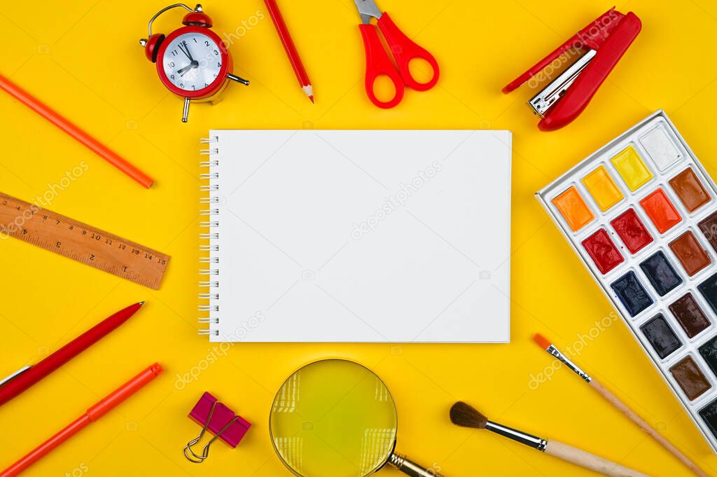 school supplies on a yellow background. High quality photo