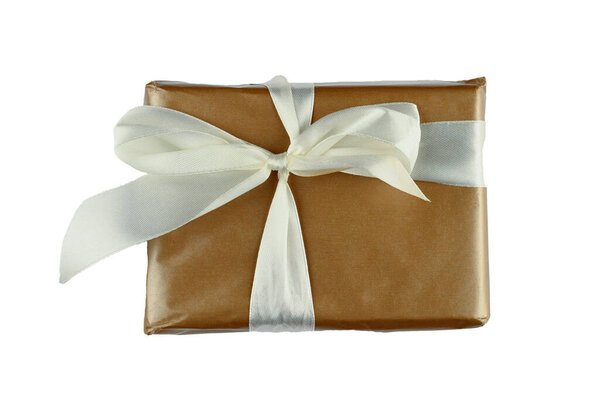 Brown gift wrap with white bow on isolated background. High quality photo