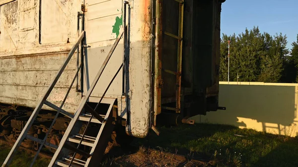 rusty train containers. worn-out trucks