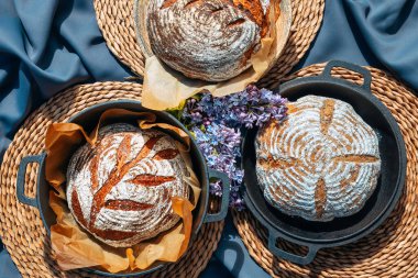 Organic homemade bread. Freshly baked artisan sourdough bread. Healthy food. With 100% whole-grain, sprouted flour and without added sugars and vegetable oils.
