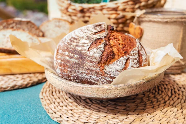 Organic homemade bread. Freshly baked artisan sourdough bread. Healthy food. With 100% whole-grain, sprouted flour and without added sugars and vegetable oils.