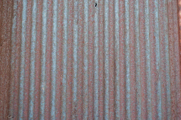 Red rusty in the row on galvanized roofing sheet