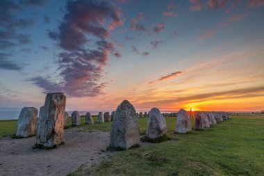 Ales Stenar - An ancient megalithic stone ship monument in Southern Sweden photographed at sunset clipart