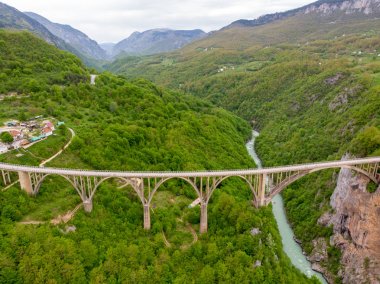 Tara river canyon. Most popular place for visit is the Durdevica bridge. Jurjevich Bridge in Zabljak, Montenegro clipart