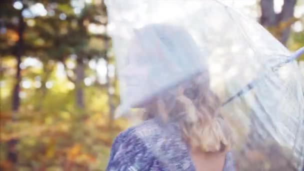 Portrait Attractive Looking Camera Smiling Playing Transparent Umbrella Autumn Forest — Stock Video