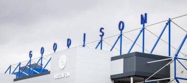 Looking up at the Goodison wording on the top of the Park End stand at Everton FC, England seen in June 2020. clipart