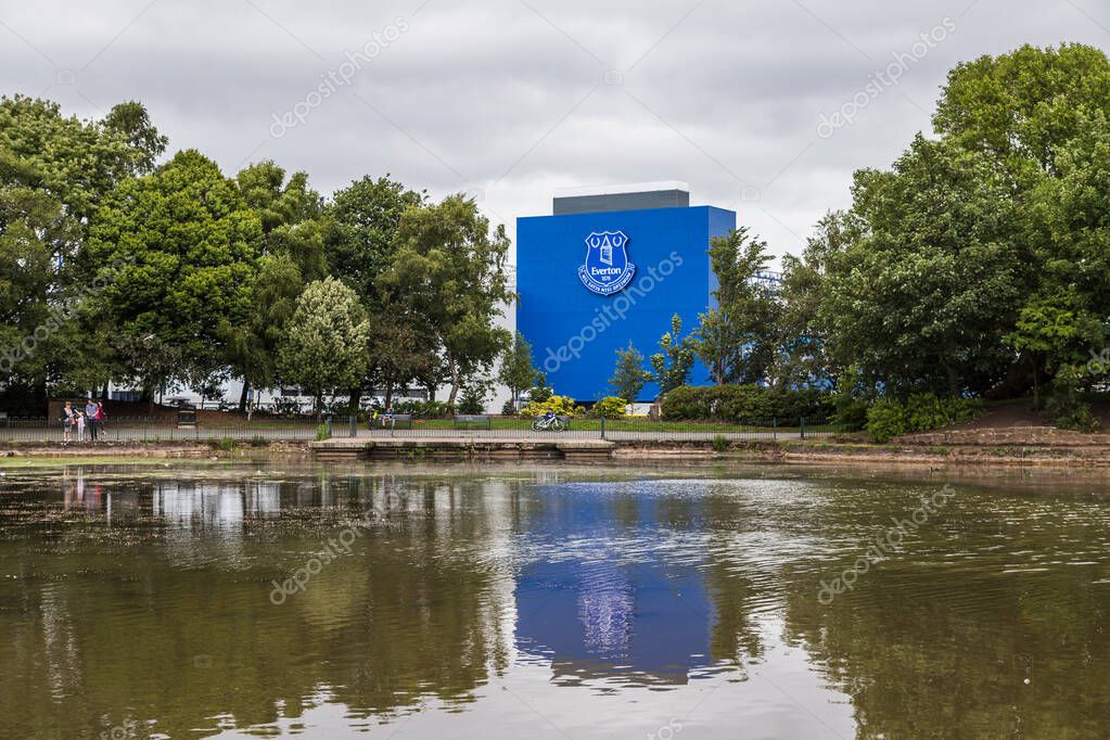 The home of Everton FC (Goodison Park) pictured reflecting in a lake within Stanley Park (England) in June 2020.