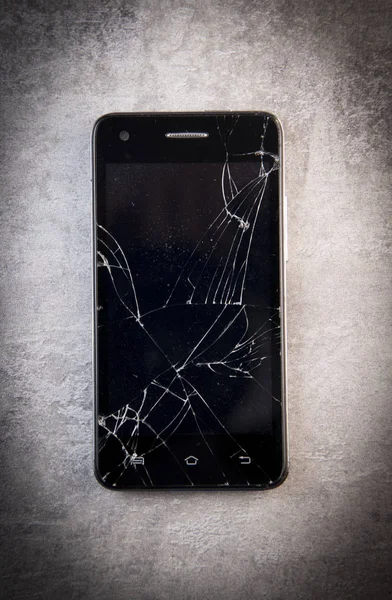 Smartphone with broken screen, broken phone