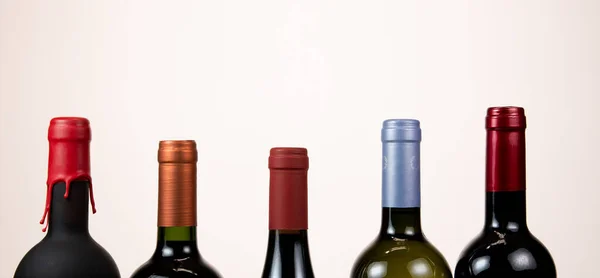 Set of collars red wine bottles isolated on white background — ストック写真