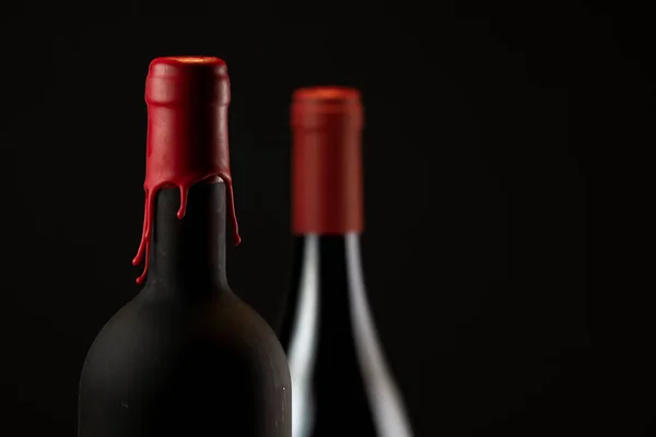 Set of collars red wine bottles isolated on black background — ストック写真