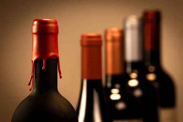 Set of collars red wine bottles isolated on black background — ストック写真