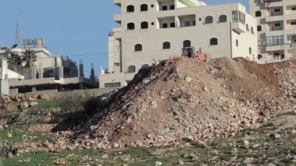 Tractor Pushing Garbage Stone Sand Palestinian Neighborhood — Stock Video