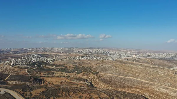 Israel Palestine border with Bir Nabala town - aerial viewdrone image divide Bir Nabala and Ramot neighborhoods northwest East Jerusalem