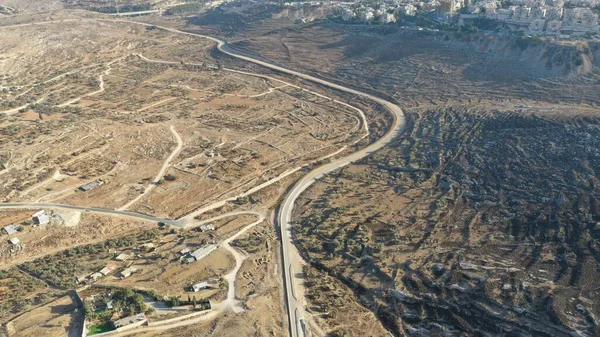 Israel Palestine border in Jerusalem Mountains- aerial viewdrone image divide Ramot and Beit hanina (Abu Dahuk) neighborhoods northwest East Jerusalem
