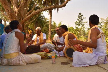 Jhargram, West Bengal, India - Hare Krishna group chants also called kirtan was performing in a village. Kirtan , group kirtan by a group clipart
