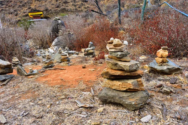 Stones piled up in prayer offerings in Paro, Bhutan.