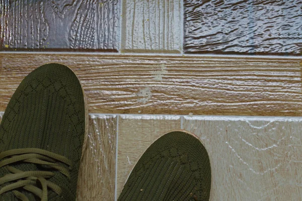 still life with Men's Casual Shoes on wooden table over grunge background