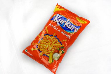Jhargram, West Bengal, India; August 1, 2025: Famous Indian snacks brand Kurkure Masala Munch on white background. Indian tea snacks concepts.