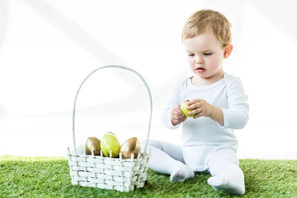 Adorable Baby Holding Yellow Chicken Egg While Sitting Straw Basket — Stock Photo, Image