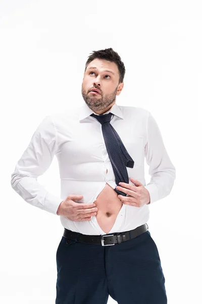 Nadváha Muž Těsné Formální Opotřebování Při Pohledu Břicho Izolované Bílém — Stock fotografie