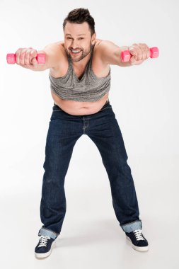 happy overweight man looking at camera while working out with pink dumbbells on white clipart