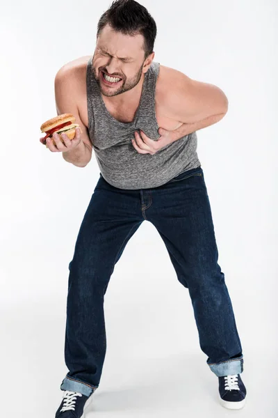 Homem Com Sobrepeso Topo Tanque Segurando Hambúrguer Tocando Peito Branco — Fotografia de Stock