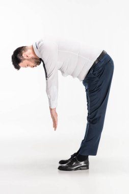 overweight man in tight formal wear bending over and stretching on white clipart