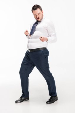overweight man in tight formal wear pointing with fingers and looking at camera on white clipart