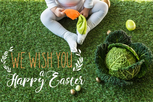 Partial View Child Holding Toy Carrot While Sitting Easter Eggs — Stock Photo, Image