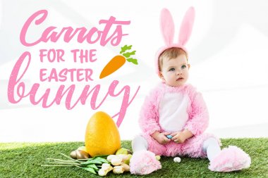 cute baby in bunny costume sitting near colorful chicken eggs, tulips and yellow ostrich egg with carrots for the Easter bunny illustration clipart