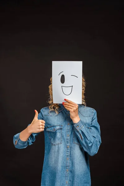 Woman Covering Face Happy Face Paper Showing Thumb Isolated Black — Stock Photo, Image