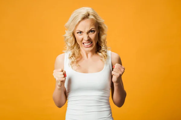 Angry Blonde Woman Looking Camera Showing Fists Isolated Orange — Stock Photo, Image