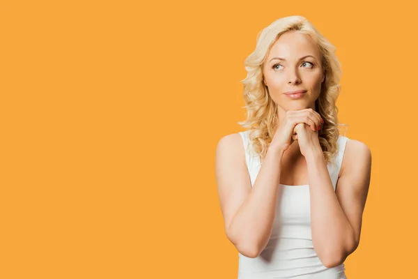 Pensive Blonde Woman Standing Clenched Hands Isolated Orange — Stock Photo, Image