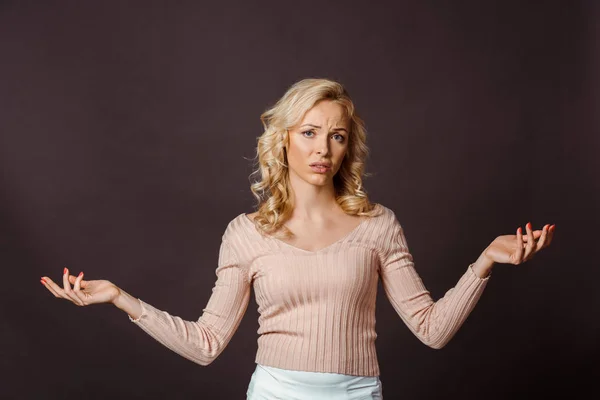 Beautiful Blonde Woman Showing Shrug Gesture Isolated Black — Stock Photo, Image