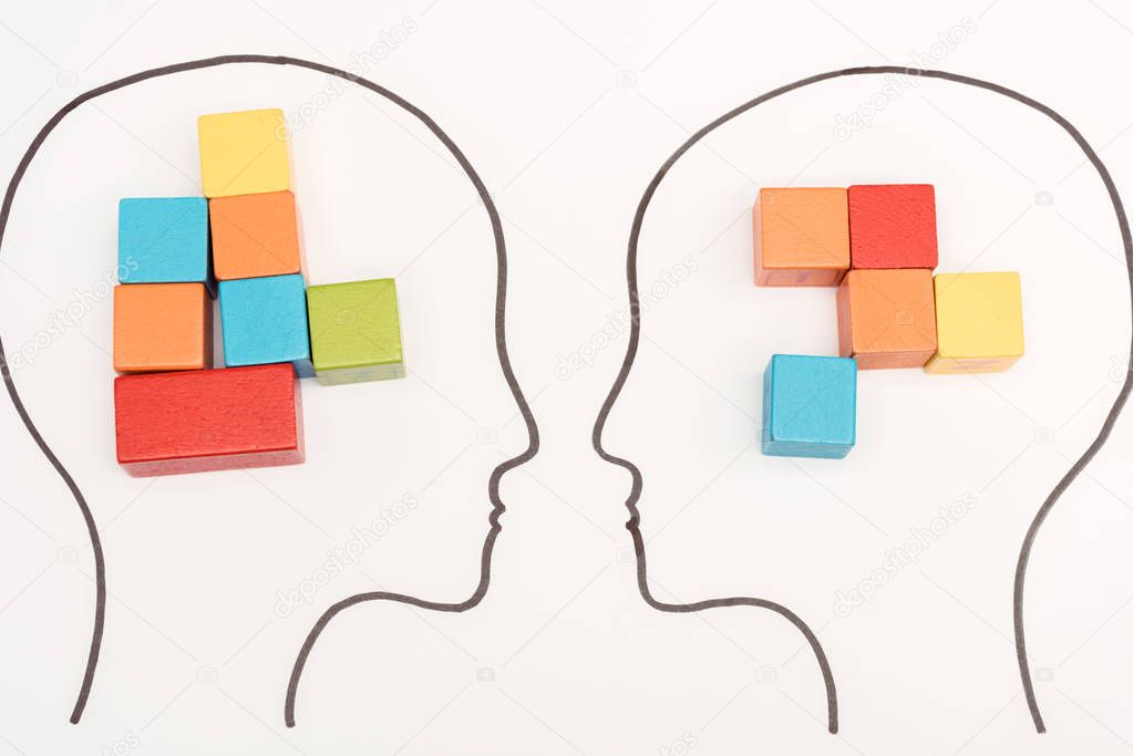 heads with colorful abstract wooden cubes isolated on white