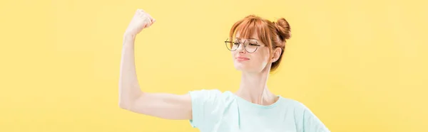 Panoramic Shot Confident Pleased Redhead Girl Glasses Shirt Holding Fist — Stock Photo, Image