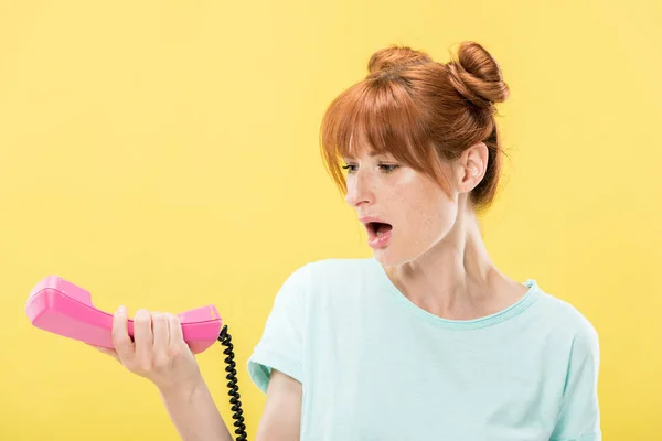 Shocked Redhead Young Woman Holding Handset Isolated Yellow — Stock Photo, Image