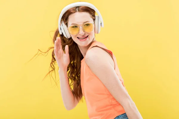 Attractive Redhead Woman Sunglasses Listening Music Headphones Smiling Isolated Yellow — Stock Photo, Image
