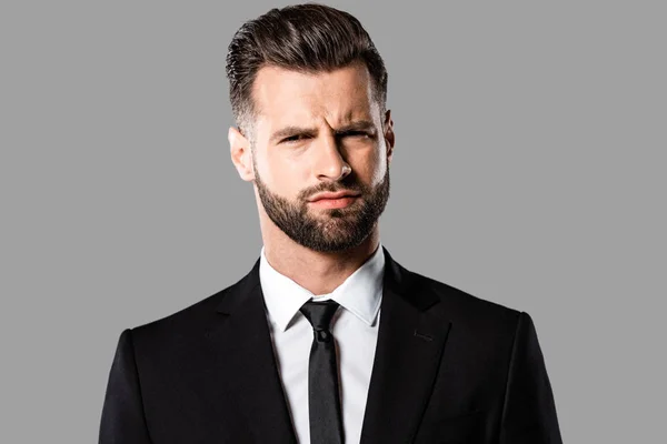 Skeptical Handsome Businessman Black Suit Isolated Grey — Stock Photo, Image